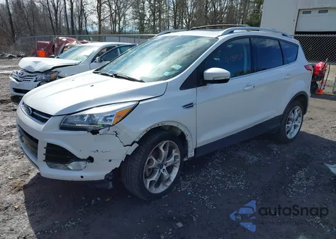 2016 Ford Escape Titanium z USA, uszkodzony, nr VIN 1FMCU9J94GUA89427